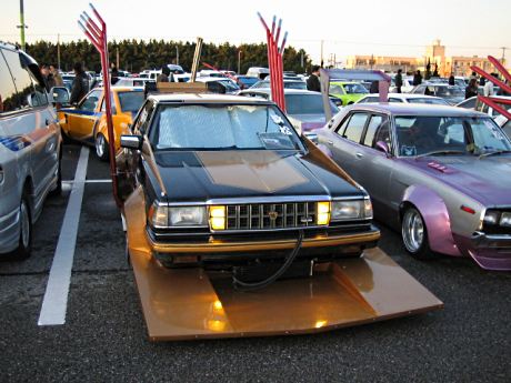 Toyota Crown S130 with spread winged exhaust