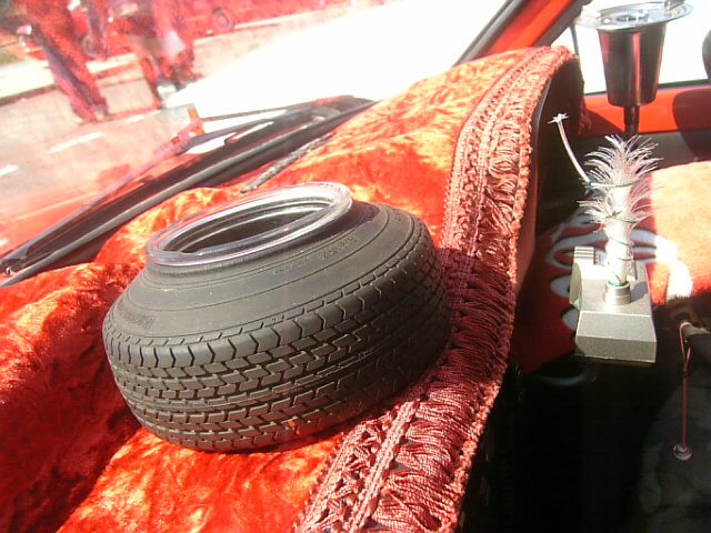 Stretched tire dashboard ornament